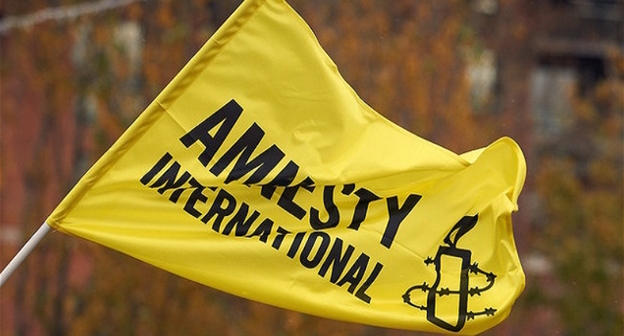 Флаг Amnesty International, фото: пресс-служба https://www.amnesty.eu/ Флаг Amnesty International, фото: пресс-служба https://www.amnesty.eu/