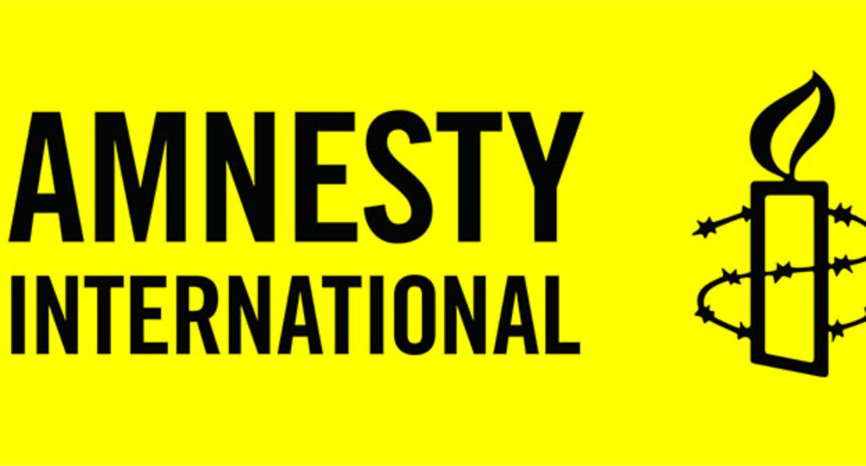 Логотип Amnesty International. Фото: https://en.wikipedia.org